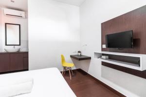 TV a/nebo společenská místnost v ubytování Kak Garden Inn