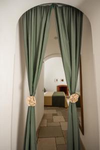 Postel nebo postele na pokoji v ubytování Il Palmento Hotel Relais