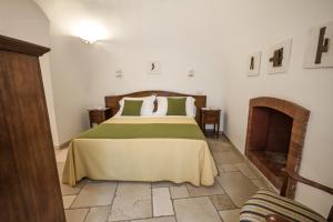 Postel nebo postele na pokoji v ubytování Il Palmento Hotel Relais
