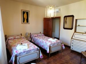 Postel nebo postele na pokoji v ubytování maximum house in subbiano