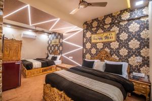 Postel nebo postele na pokoji v ubytování Onn Shelter Inn