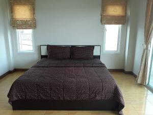 Una cama o camas en una habitación de Uncle House Krabi