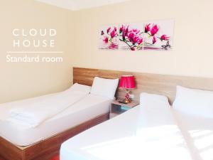 Postel nebo postele na pokoji v ubytování Cloud House Sapa