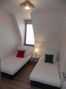 Кровать или кровати в номере Apartamenty Starówka
