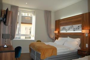 Postel nebo postele na pokoji v ubytování Apollo Hotel Vienna + 37 fotografií