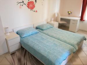 Postel nebo postele na pokoji v ubytování Vile Park Apartments