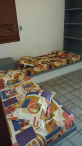 Habitación con 2 camas individuales en Chalés Recanto dos Golfinhos en Ponta do Funil