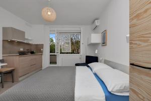 Кровать или кровати в номере Apartments & Rooms Rica