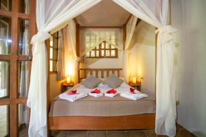 Katil atau katil-katil dalam bilik di Hotel Casa Merlin