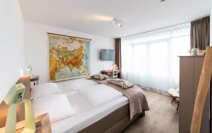 Postel nebo postele na pokoji v ubytování Het Vlielandhotel