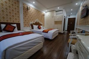 Ένα ή περισσότερα κρεβάτια σε δωμάτιο στο Busan Hotel