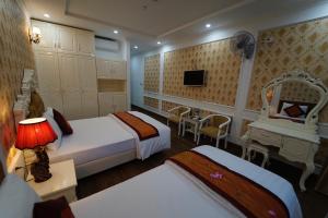 Ένα ή περισσότερα κρεβάτια σε δωμάτιο στο Busan Hotel