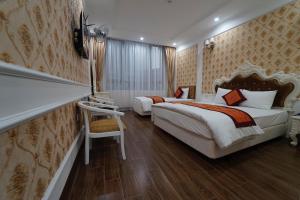 Ένα ή περισσότερα κρεβάτια σε δωμάτιο στο Busan Hotel