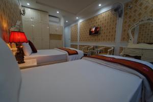 Ένα ή περισσότερα κρεβάτια σε δωμάτιο στο Busan Hotel
