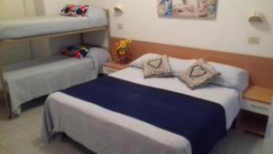 A bed or beds in a room at Hotel Sabrina Még 13 kép