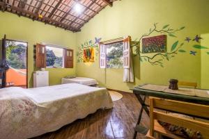 Ein Bett oder Betten in einem Zimmer der Unterkunft Espaço Matagal