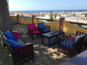 
a beach area with chairs, tables, chairs and umbrellas at Cortijo Amaya in Torrox Costa
