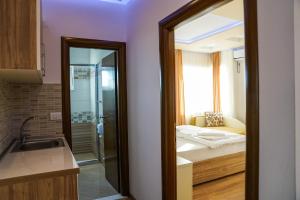 Ένα ή περισσότερα κρεβάτια σε δωμάτιο στο Apart Hotel Llolla
