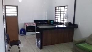 a kitchen with a counter top in a room at Sítio Luar in São Roque de Minas