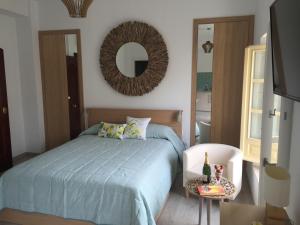 Łóżko lub łóżka w pokoju w obiekcie NATURA SUITE MÁLAGA