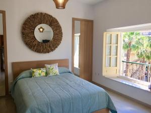 Łóżko lub łóżka w pokoju w obiekcie NATURA SUITE MÁLAGA