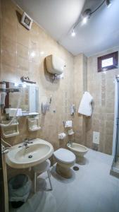 a bathroom with a sink and a toilet at Ravello View in Scala