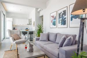 a living room with a couch and a table at CasAlma I in Plános