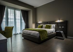 Un pat sau paturi într-o cameră la Hotel Matilde - Lifestyle Hotel