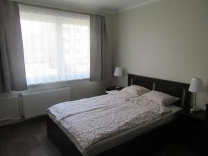 Кровать или кровати в номере Family Apartment
