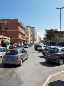 a bunch of cars parked in a parking lot at Michelangelo Apartment in Civitavecchia