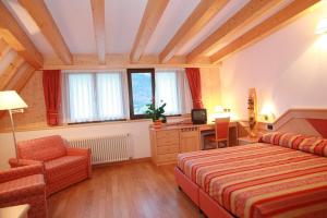 Postel nebo postele na pokoji v ubytování Hotel Regent's