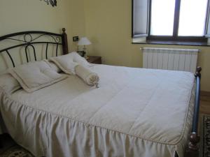 Ένα ή περισσότερα κρεβάτια σε δωμάτιο στο Casa Maria