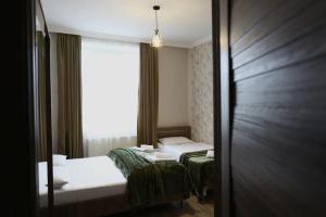 Voodi või voodid majutusasutuse Ia's Guest House toas