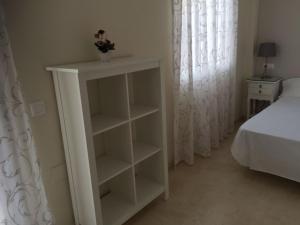 Posteľ alebo postele v izbe v ubytovaní Casa El Campanario