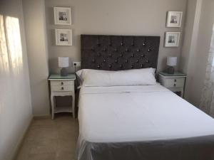 Posteľ alebo postele v izbe v ubytovaní Casa El Campanario