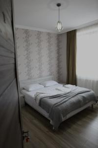Voodi või voodid majutusasutuse Ia's Guest House toas