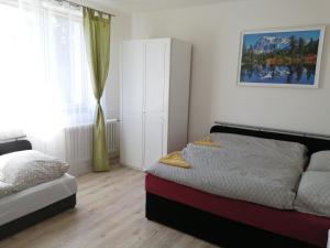 Postel nebo postele na pokoji v ubytování Apartmán Hugo