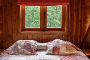 Postel nebo postele na pokoji v ubytování Petrohue Lodge