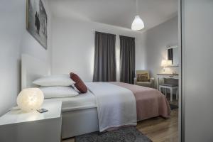 En eller flere senge i et værelse på Apartman Anastazija