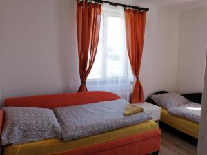 Postel nebo postele na pokoji v ubytování Apartmán Hugo