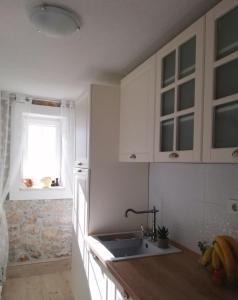 Kuchyňa alebo kuchynka v ubytovaní Charming apartment piccolo paradiso