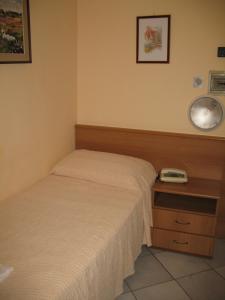 Postel nebo postele na pokoji v ubytování Albergo Paradiso