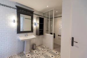 a white bathroom with a sink and a shower at Le Clos de la Pointe Saint-Mathieu in Plougonvelin +83 photos
