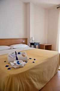 Postel nebo postele na pokoji v ubytování Hotel Leuco'