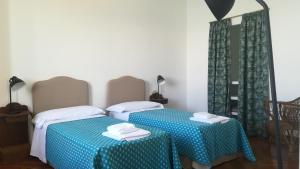 A bed or beds in a room at Villa Martelli