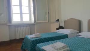 A bed or beds in a room at Villa Martelli