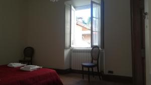 A bed or beds in a room at Villa Martelli