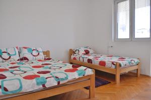 Кровать или кровати в номере Center Apartments Skopje