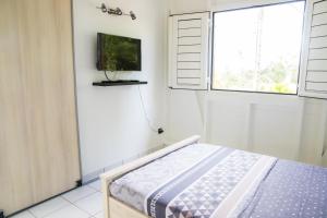 Llit o llits en una habitació de Gîte spacieux avec Jacuzzi - ****5 étoiles****