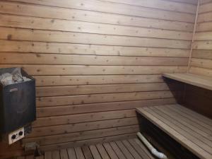 an empty sauna with wooden walls and benches at Rib Mountain Inn in Wausau